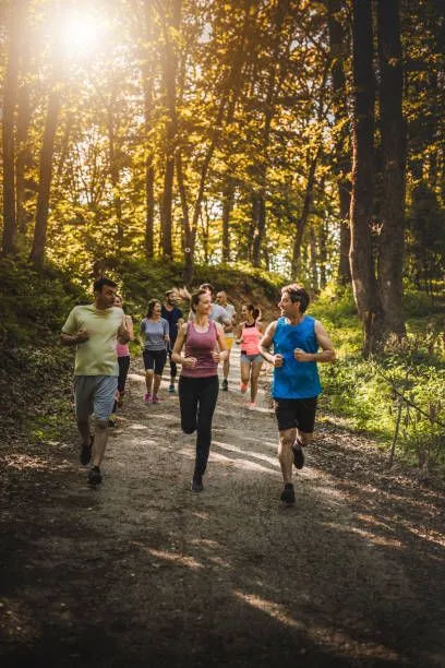 Trail runners on a misty mountain path